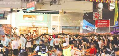 Crowd chasing after the dragon