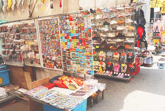 Stalls selling souvenirs and shoes